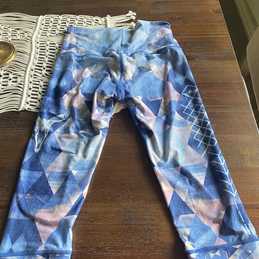 Cropped, breathable yoga Capri with fun print.